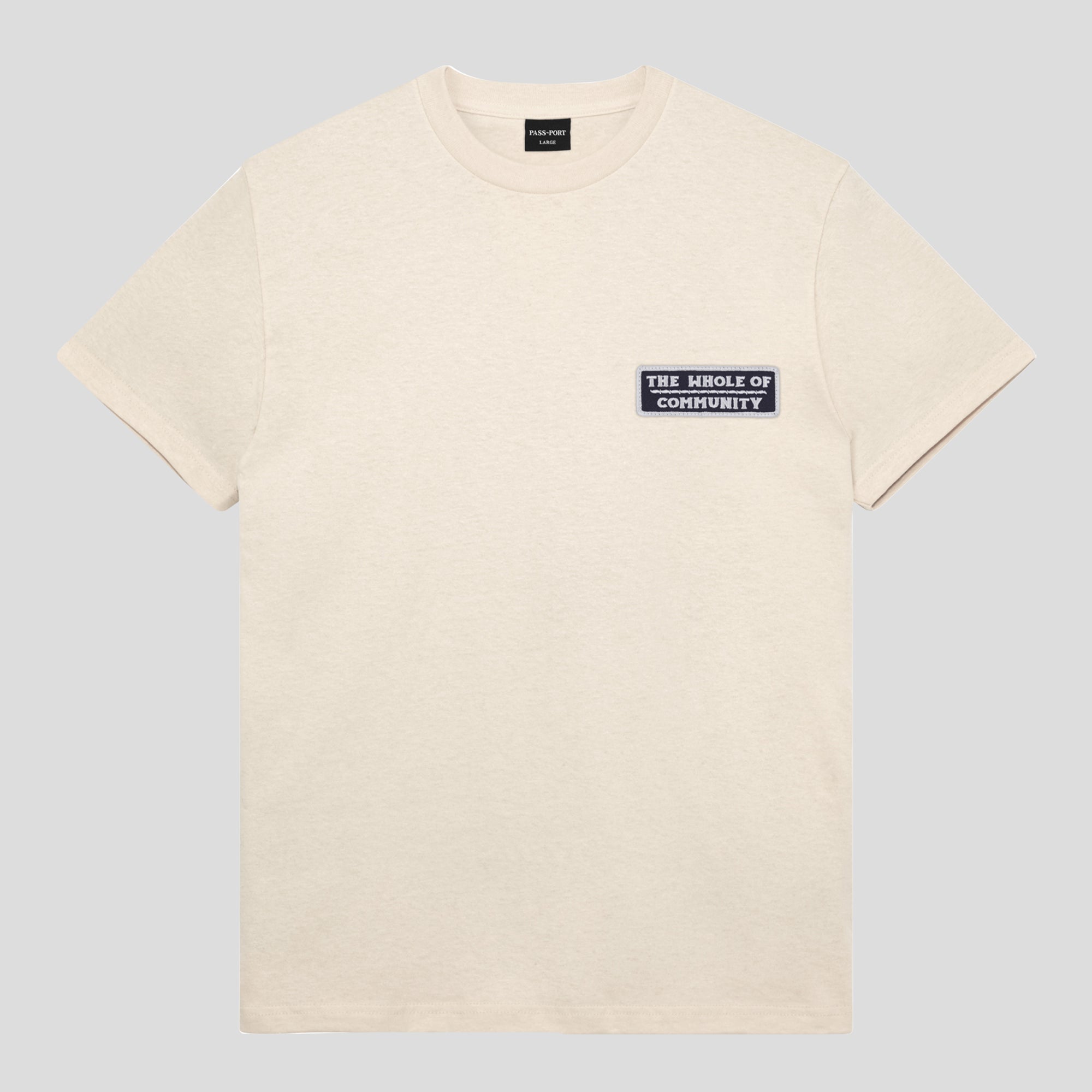 PASS~PORT "WHOLE OF COMMUNITY" TEE NATURAL